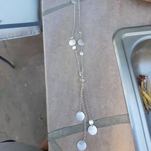 Long silver finish necklace. Detachable dangling disks